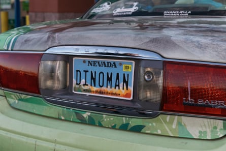 a Nevada rear license plate reads “DINOMAN”