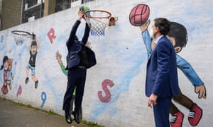 Mayor of London Sadiq Khan (L) and Shadow Secretary of State for Business Ed Miliband playing basketball during a campaign visit to Fairfield Play Centre in London, which is reopen for business.