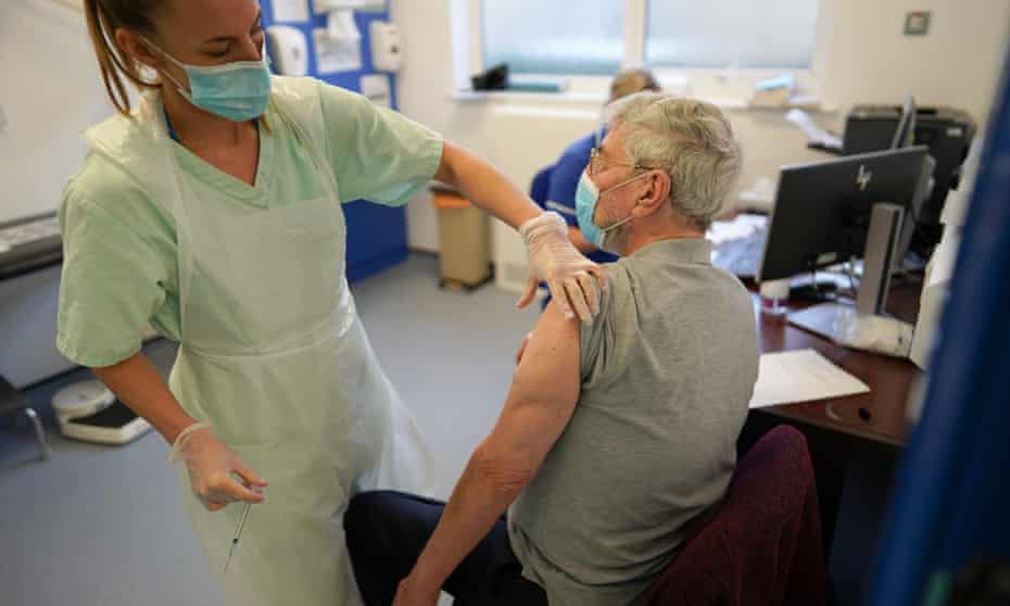 Patients receiving the Pfizer/BioNTech vaccine at a GP surgery in York, December 2020