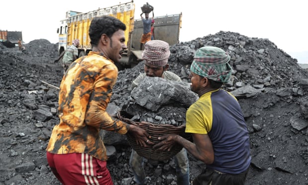 Workers transporting coal in Jharkhand, eastern India, 2019