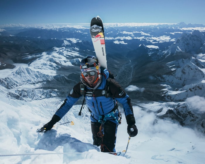 Polish skier becomes first person to climb Everest and ski down without extra oxygen – video