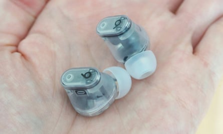 Beats Studio Buds+ earbuds in the palm of a hand.