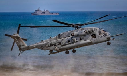 A US Marine helicopter takes off as US and Philippine marines take part in a joint amphibious assault exercise off the waters of the South China Sea in March 2022.