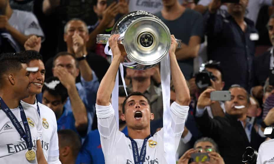 Cristiano Ronaldo of Real Madrid holds aloft the Champions League trophy