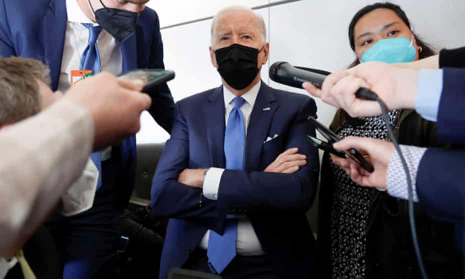 Joe Biden speaks to reporters aboard Air Force One, 22 April 2022. 