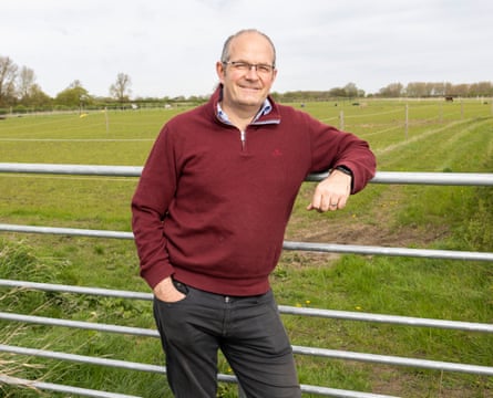 Tom Bradshaw leans on a field gate