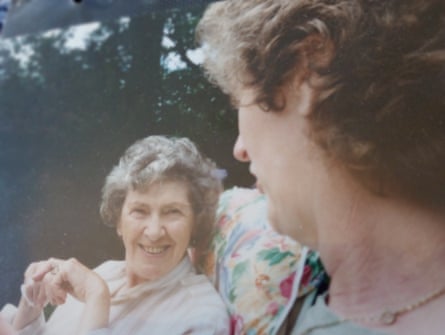 Old family photo of Judy and Elsie sat talking in the garden