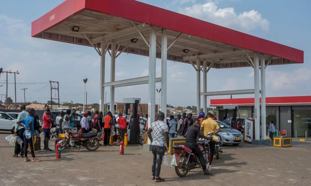 People wait to buy fuel at a petrol station in Area 49, Lilongwe.