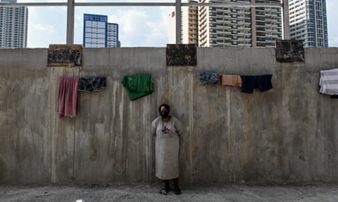 Behind these walls in central Manila are legions of homeless people – all struggling to survive the pandemic.