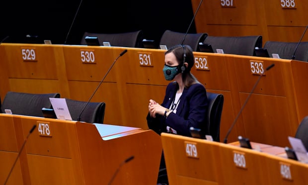 A MEPt wears mask in an almost empty European parliament in Brussels last week.