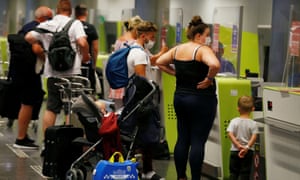 British tourists returning to UK, check in their luggage, as Britain imposed a two-week quarantine on all travellers arriving from Spain, at Gran Canaria Airport, on the island of Gran Canaria, Spain on Saturday.