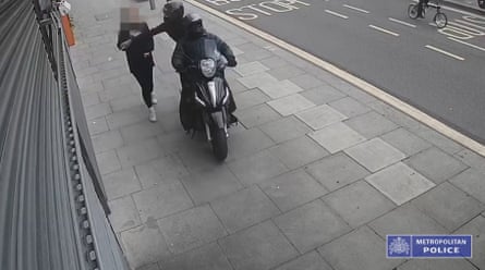 A CCTV camera captures the moment when thieves on a moped snatch a phone in London.