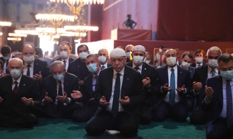 Erdoğan (centre) with his senior ministers. The president began the service with a recital from the Qur’an.