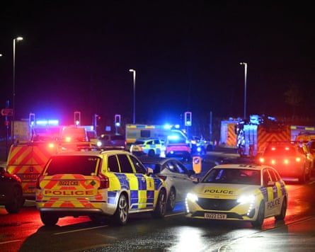 Police vehicles at night with blue lights on