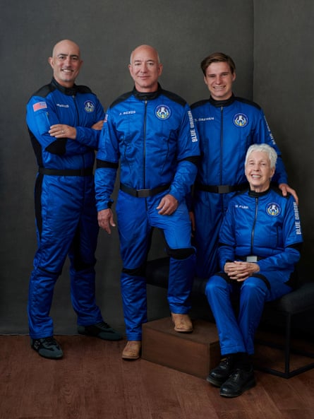 Jeff Bezos, Mark Bezos, pioneering female aviator Wally Funk and recent high school graduate Oliver Daemen pose ahead of their scheduled flight.