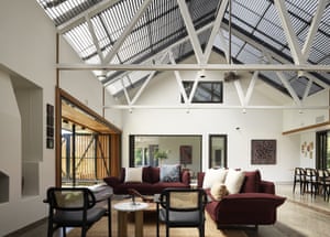 A living space inside the Kingfisher house, with high ceilings, opening onto an internal courtyard.