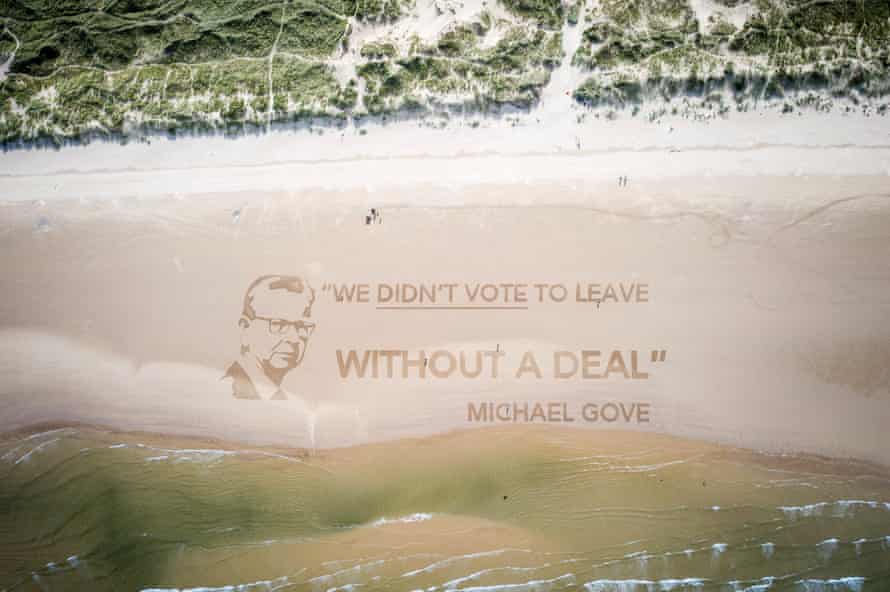 Photo issued by Led By Donkeys of a sand installation on Redcar beach in North Yorkshire which depicts Michael Gove next to his quote “We didn’t vote to leave without a deal.”