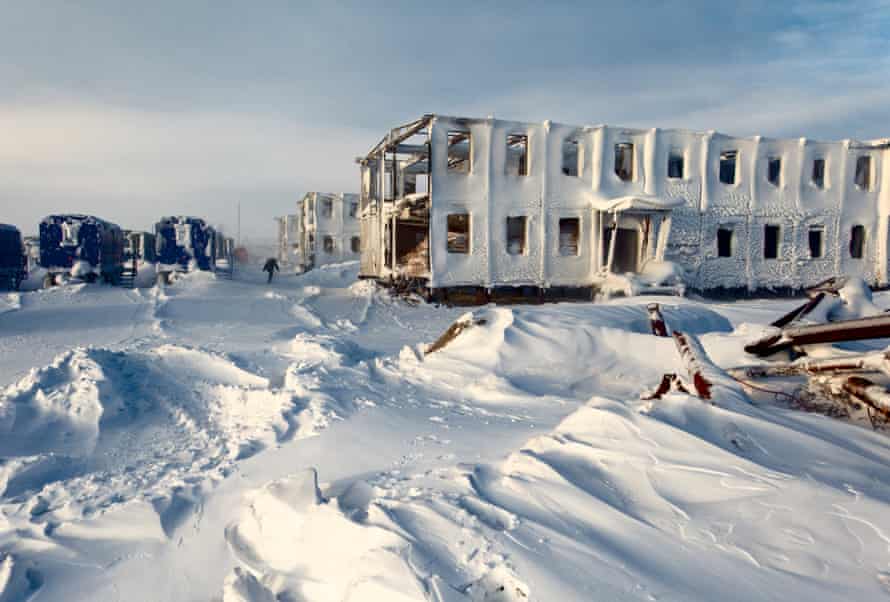 Oil and gas company Bashneft arrives with their workers and containers (left, in blue) after a previous attempt by another exploration company was abandoned (on the right, covered in snow). Bashneft plans to build a gas well here in the Nenets Autonomous Region in the Russian Arctic.