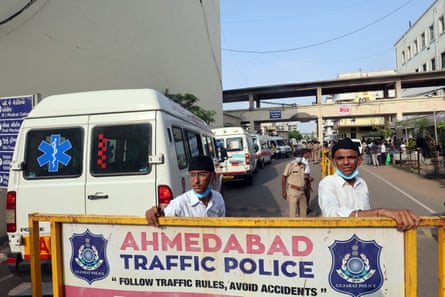 Ambulances and staff outside a hospital in India
