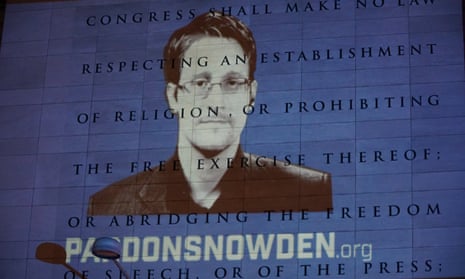 An image of Edward Snowden is projected on to the side of the Newseum, in Washington DC.
