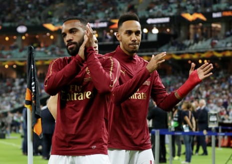 Arsenal’s Alexandre Lacazette (left) and Pierre-Emerick Aubameyang applaud the fans during the warm up.