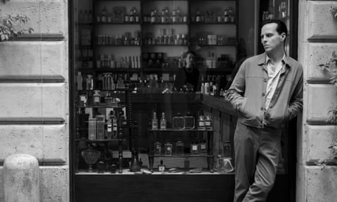 Andrew Scott as Tom Ripley, standing in a bar doorway in Italy.