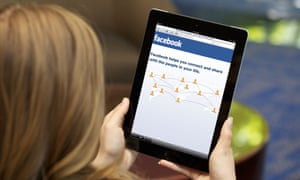 Woman using Facebook on an iPad