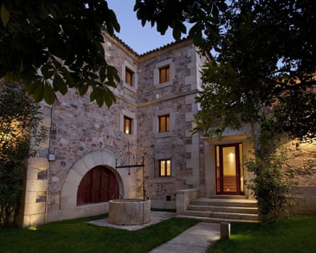 Exterior of a historic parador at dusk