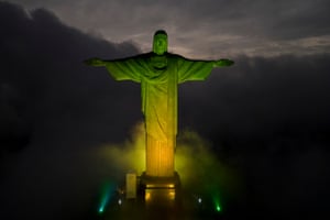 The Christ the Redeemer statue is lit in the colours of the Brazilian national flag to honour Pelé