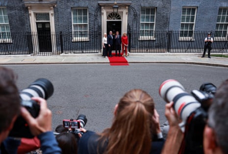 The two couples posing for pictures outside No 10.