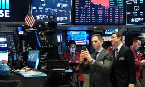Traders on the floor of the New York Stock Exchange last night