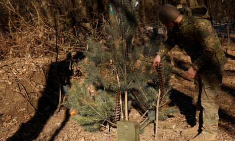 Ukrainian service personnel decorate a Christmas tree with ammunition, near Soledar, Ukraine, in January 2023.