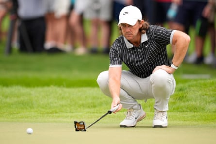 Tommy Fleetwood lining up a putt at East Lake.