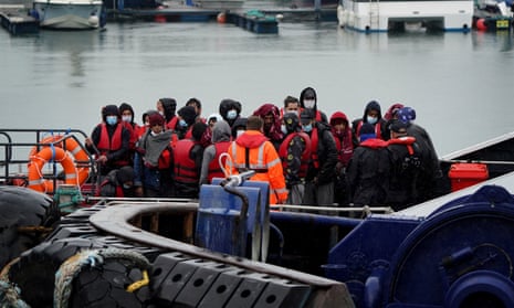 A group of people are brought to Dover, Kent, onboard a Border Force vessel after a small boat incident in the Channel