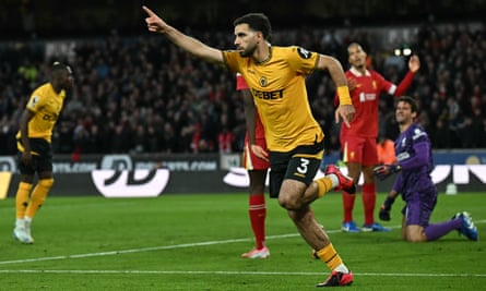 Rayan Aït-Nouri celebrates after equalising for Wolves in the second half.