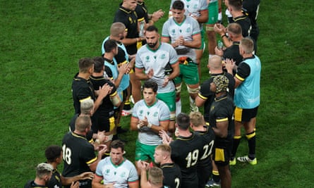 Wales players applaud Portugal following the Rugby World Cup Pool C match in Nice.
