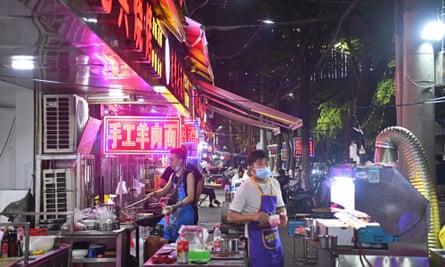 A busy night market in Wuhan, which has reported no asymptomatic Covid-19 cases after widespread testing.