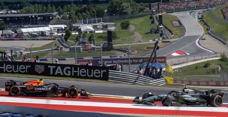 Max Verstappen (left) is knocked out of the Austrian Grand Prix in the opening lap