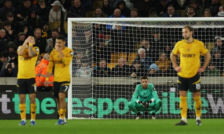José Sá and his Wolves teammates look dejected after Justin Kluivert scored his third penalty