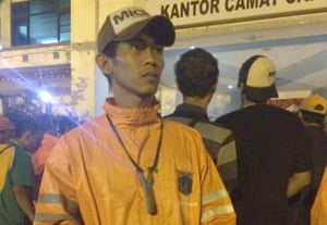 Samin with the homemade catapult he used to stun and catch six rats.