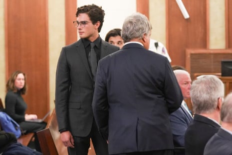 people stand and sit in court