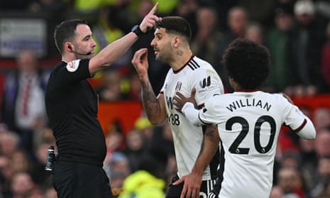Fulham’s Aleksandar Mitrovic confronts the referee Chris Kavanagh during his side’s FA Cup quarter-final at Manchester United
