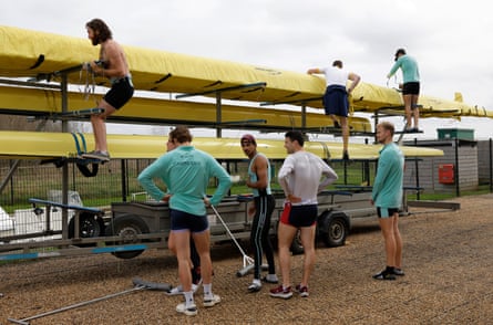 The men’s blue boat pack their boat on to a trailer for the trip down to London for the Boat Race at their Ely training site, Cambridgeshire.