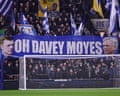 Everton fans hold up a banner of their manager David Moyes at a match