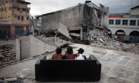 In an image from June 2010, sex workers wait for clients among the debris of homes destroyed by the earthquake in Port-au-Prince