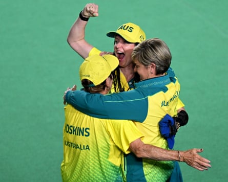 Louise Hoskins, Serena Bonnell and coach Karen Murphy celebrate their winning moment.