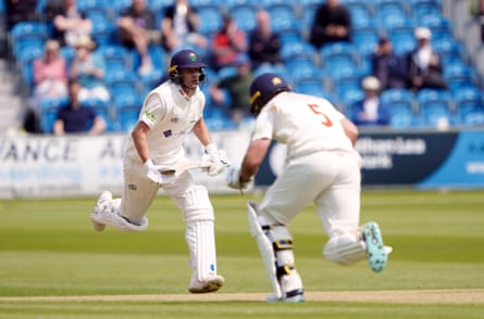 Glamorgan's Billy Root (left) and Kiran Carlson run between the wickets as they bat against Sussex.