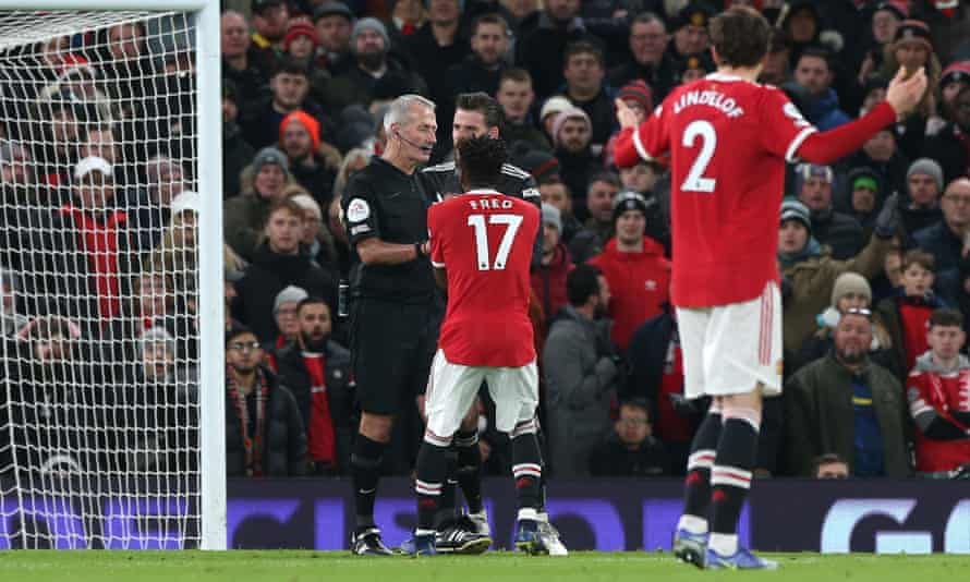 Fred, who had trodden on David de Gea, and the Manchester United keeper protest to Martin Atkinson