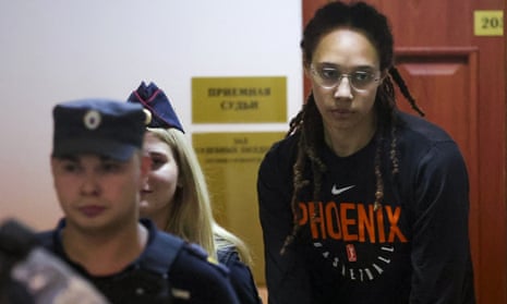 Brittney Griner is escorted to a courtroom for her hearing on Wednesday
