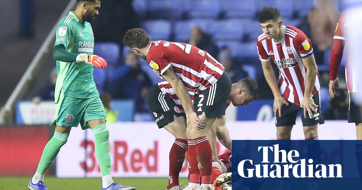 Championship roundup: Blades’ Fleck taken off on stretcher in win at Reading